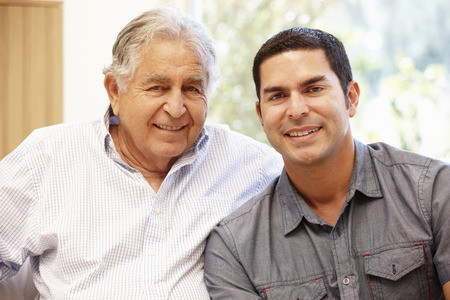 42109283 - hispanic father and adult son